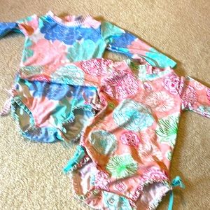 Two (2) Rufflebutts baby girl swimsuits in 18-24months size. Like new!